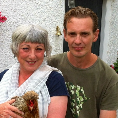 Lint Mill1 Man and a woman holding a hen