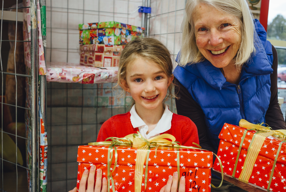 Christmas Donations Blog Person giving presents